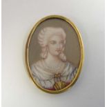 A 19thC oval miniature watercolour on ivory depicting a lady holding a fan with pearl necklace etc.