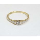 An 18ct gold ring having a platinum set diamond solitaire CONDITION: Please Note -