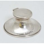 A silver capstan formed inkwell hallmarked Birmingham 1907 maker T H Hazlewood & Co.