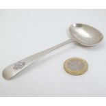 A Silver Child's feeding spoon hallmarked Sheffield 1921 maker Henry Williamson Ltd.