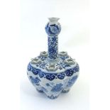 A Chinese blue and white tulip vase, depicting a pond scene with lilies, peonies and ducks,