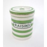 A 21st C Retro cornishware green and white banded food storage jar marked 'raisins'.