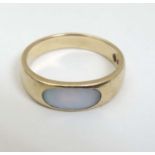 A 9ct gold ring set with mother of pearl CONDITION: Please Note - we do not make