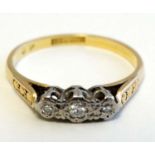 An 18ct gold ring with trio of diamonds to top CONDITION: Please Note - we do not