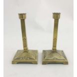 Decorative Metalware : A pair of German Art Nouveau cast brass squared candlesticks marked