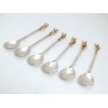 A 6 silver spoons each surmounted by various gilt historical / military figures / knights to
