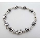 A silver bracelet with elephant decoration approx 6" long CONDITION: Please Note -