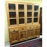 A 21stC glazed top dresser having four drawers and four cupboard doors.