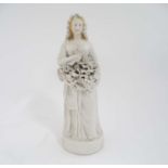 A late 19th/early 20th C parian bisque female figure/ goddess carrying grapes for grape harvest