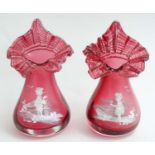 A pair of Cranberry glass Jack in the pulpit style vases with Mary Gregory style decoration.