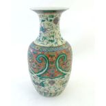 A Chinese famille verte vase decorated with polychrome enamels,