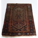 Carpet / rug : a signed Persian woollen rug having yellow.