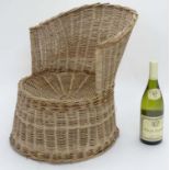 An early - mid 20thC wicker child's chair,