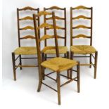 A matched set of 4 stained wood ladder back chairs with envelope rush and seagrass seats.