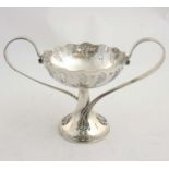 An Art Nouveau silver plate twin handled pedestal tazza with pierced decoration.
