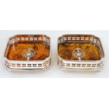 A pair of silver plate coasters with faux tortoiseshell bases. 21stC .