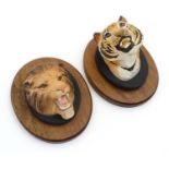 A Beswick lion's head wall plaque , number 2933 and a Beswick Tiger's head wall plaque ,