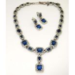 Costume Jewellery : A vintage blue and white stone necklace with matching earrings by Ciner .