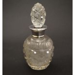 A cut glass scent bottle with silver collar hallmarked London 1924 6" high overall