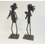 Vintage Retro : a pair of painted steel comical figures,