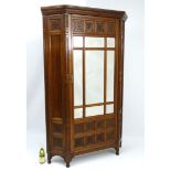 An Arts and Crafts walnut Vestment Cupboard / Hall Cloak Cabinet in the manner of Bruce James