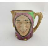 A Royal Doulton 'Touchstone the Jester' character Toby jug, painted in purple,