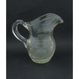 A 19thC clear cut glass crystal jug with loop handle.