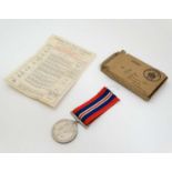 Militaria : A WWII 1939-45 War Medal , together with OHMS postage box and award slip .