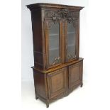 An 18thC / 19thC Continental carved oak display buffet / Mueble deux corps 90 1/2" high x 58 1/4"