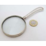 A silver handed magnifying glass 5 1/2" long overall CONDITION: Please Note - we do