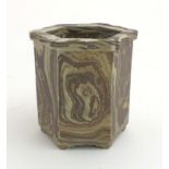A Chinese agate ware brush pot of hexagonal form on 6 feet in brown and white marbled effect,