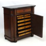 A 19thC Biedermeier style walnut and ebonised wood black marble topped side cabinet 39" high x 18