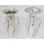 Arts & Crafts : A pair of silver plate T&G vases marked under.