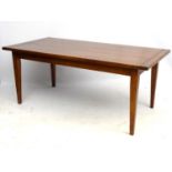 A late 20thC cherry wood dining table standing on squared tapering legs.