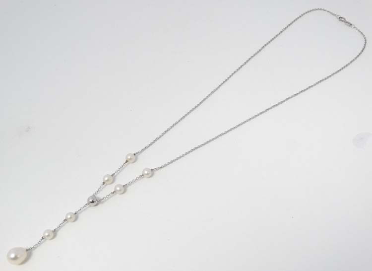 A 9ct white gold necklace set with pearls .
