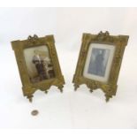 A pair of 19thC easel / strut photograph frames having cast brass Kent style frame with cabochon