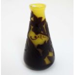 A small cameo glass vase, the yellow ground with brown floral detail . Signed ' Gallé ' .