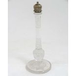 A cut crystal pedestal candlestick with juddaha candle to top 12 3/4"high CONDITION: