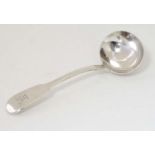 A silver fiddle pattern sauce ladle hallmarked London 1836 maker T W.