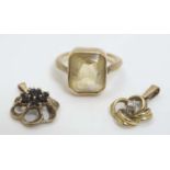 A yellow metal ring set with citrine coloured stone together with 2 9ct gold pendants,