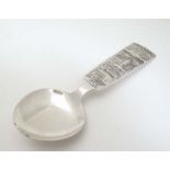 A Souvenir silver plate spoon with scenes of Stockholm Sweden to handle. Maker C G Hallberg.