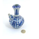 A small Chinese blue and white kendi vase with floral and crane motif designs to body,