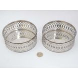 A pair of Sheffield Plate coasters with openwork decoration.