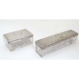 2 glass dressing table boxes with French silver tops having engine turned decoration.