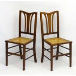 A pair of early 20thC mahogany cane seated bedroom chairs with art nouveau back rests 34 1/3" high