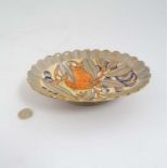 A Bursley Ware Charlotte Rhead dish depicting fruits and flowers to centre,