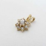 A yellow metal pendant set with white stone cluster 1/2" long CONDITION: Please
