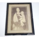 A framed sepia print of Madonna and child,