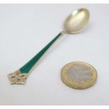 Scandinavian silver : A silver gilt teaspoon with green guilloché enamel decoration Marked 925S