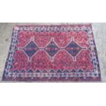 Rug / carpet :three diamonds to centre on a wine red background , many birds , and blue , white ,